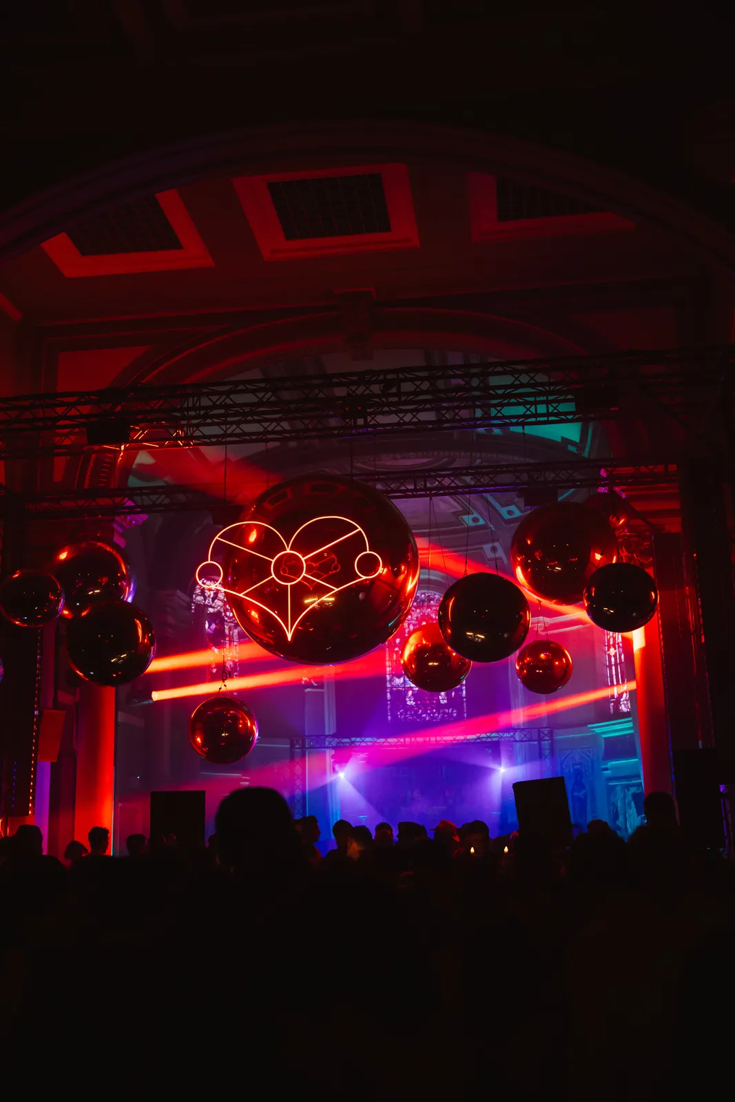 Neon heart installation hanging above the dance floor